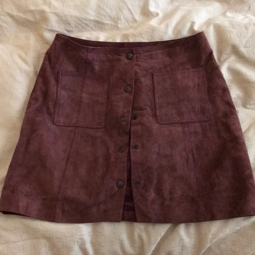Leather snap mini skirt